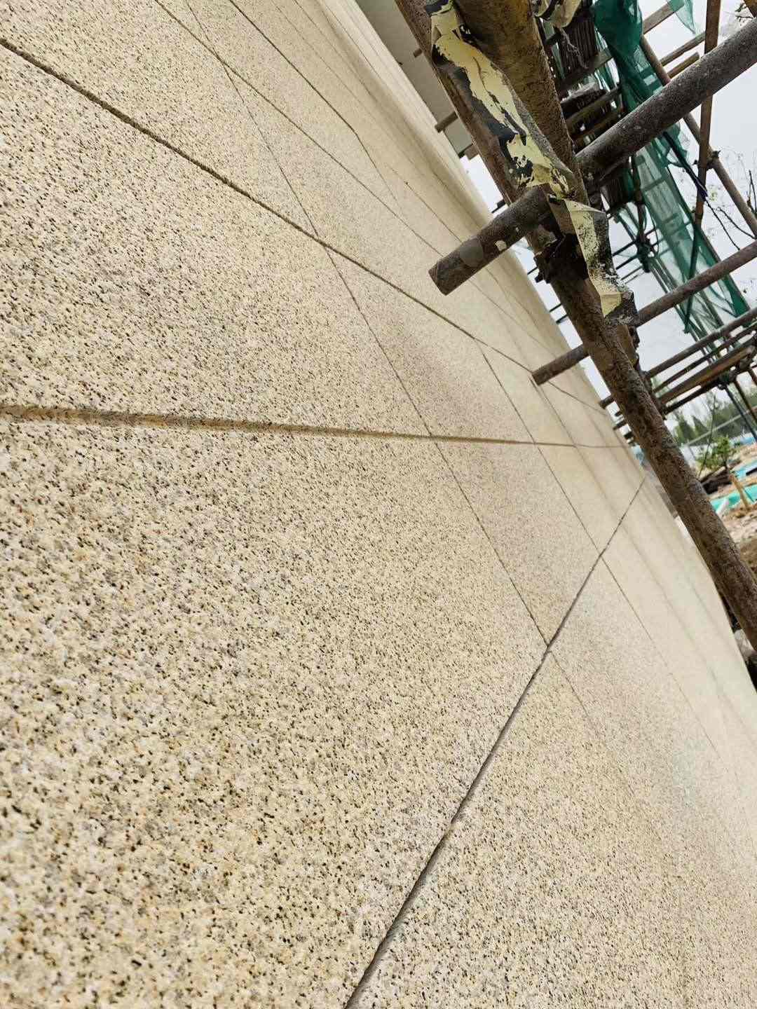 日喀则布 黄金麻花岗岩荔枝面外墙干挂石材效果示例